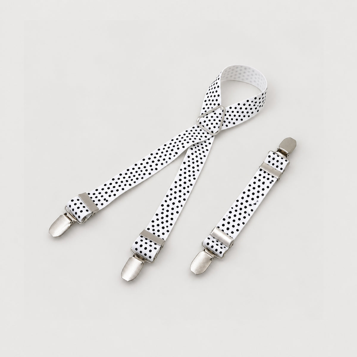 Adjustable dog diaper suspenders in Polka Dot White with elastic straps and three clips