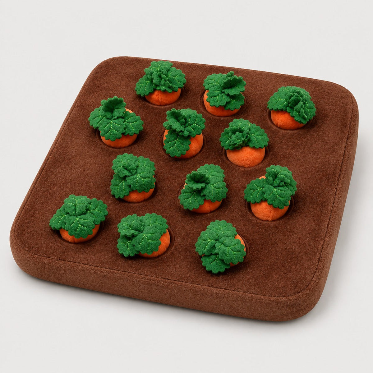 Angled view of Carrot Patch dog snuffle mat with plush carrots
