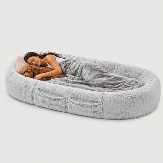 BarkTango human-size snuggle bed for dogs and their people in a cozy home setting