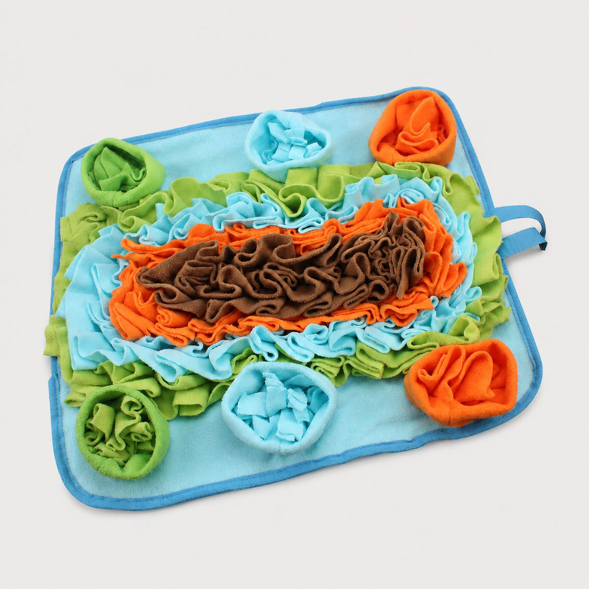 Angled view of colorful nosework snuffle mat for dog enrichment