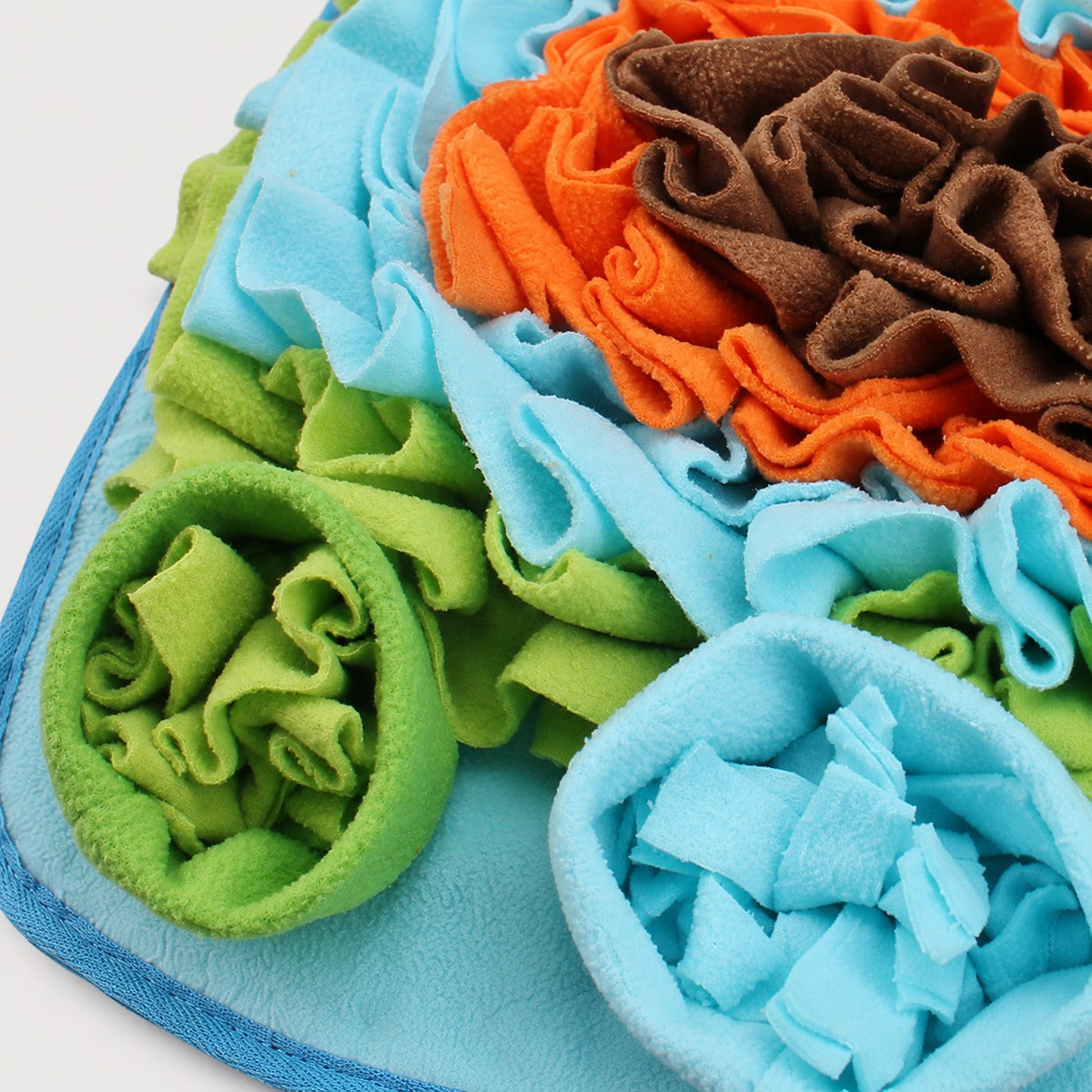 Close-up of fleece folds and treat pockets on dog snuffle mat