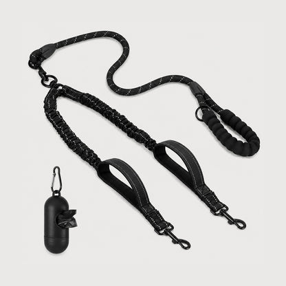 Reflective dual dog leash with shock-absorbing bungee leads for walking two dogs.