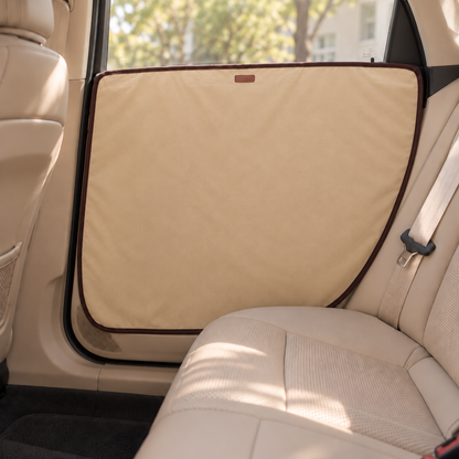Beige dog car door guard installed over door trim and recessed handle area