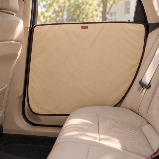 Beige dog car door guard installed over door trim and recessed handle area