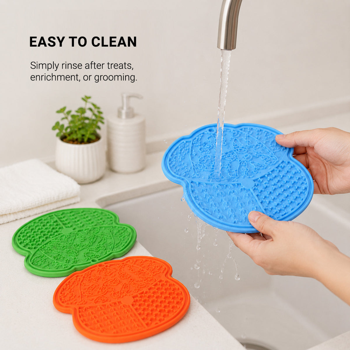 CalmLick silicone dog lick mat rinsing clean under running water