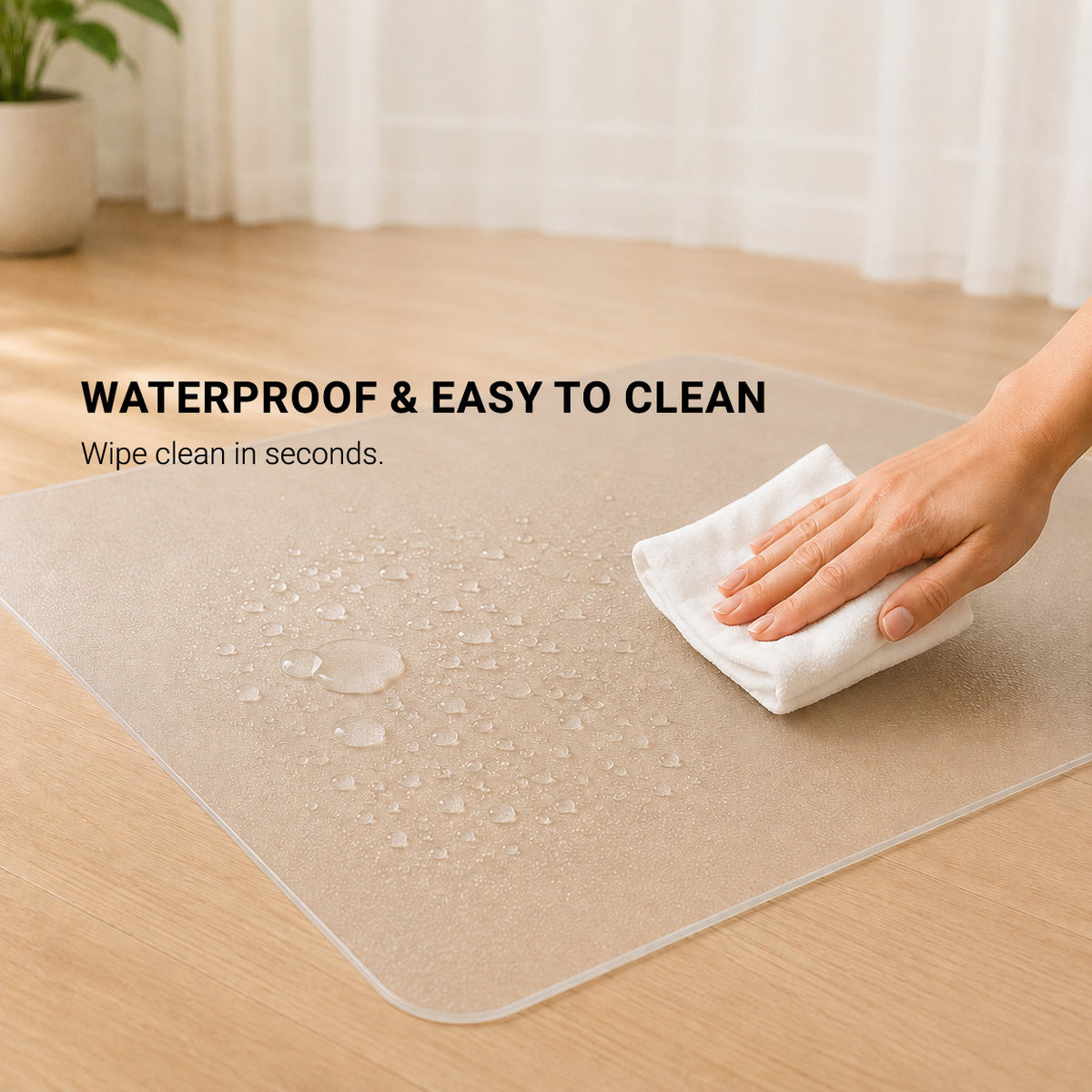 ClearGuard waterproof pet floor protector mat with water droplets being wiped clean