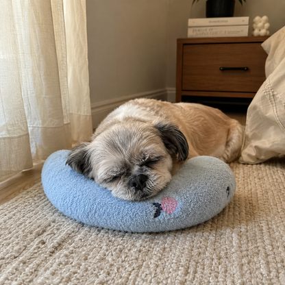 Senior dog relaxing at home with a CozyRest low-profile U-shaped headrest pillow