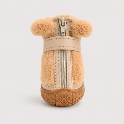 Close-up of CozyStep winter dog boot with front zipper, strap and textured traction sole