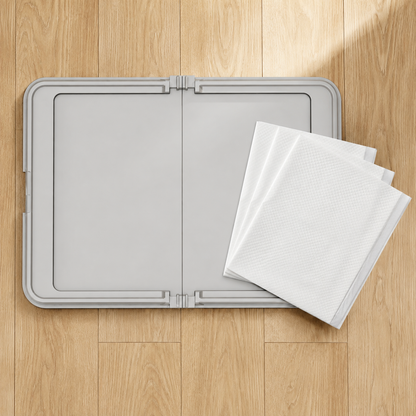 Gray reusable dog pee pad tray shown with three disposable absorbent pee pads