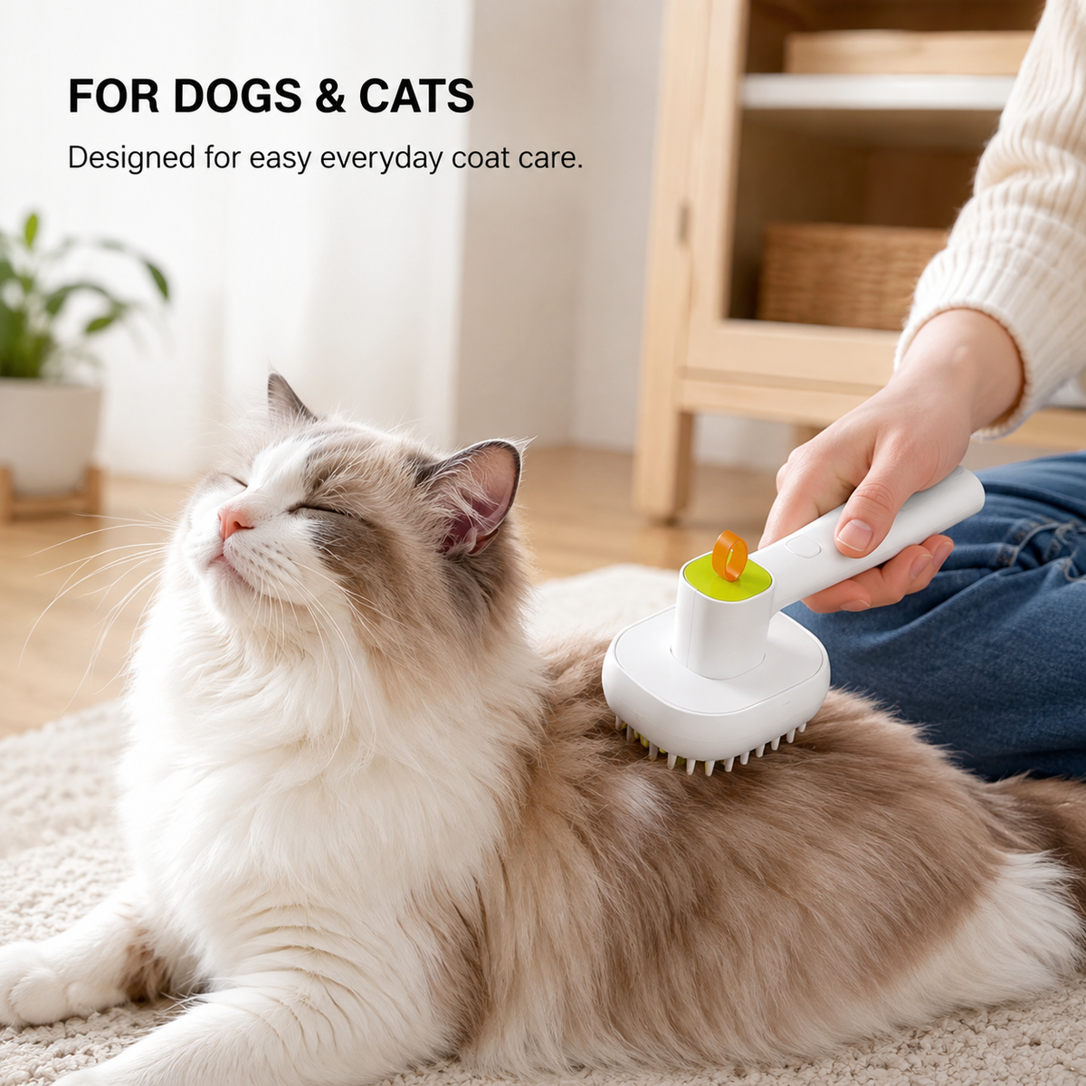 Cat being groomed with the MistEase soft mist spray brush