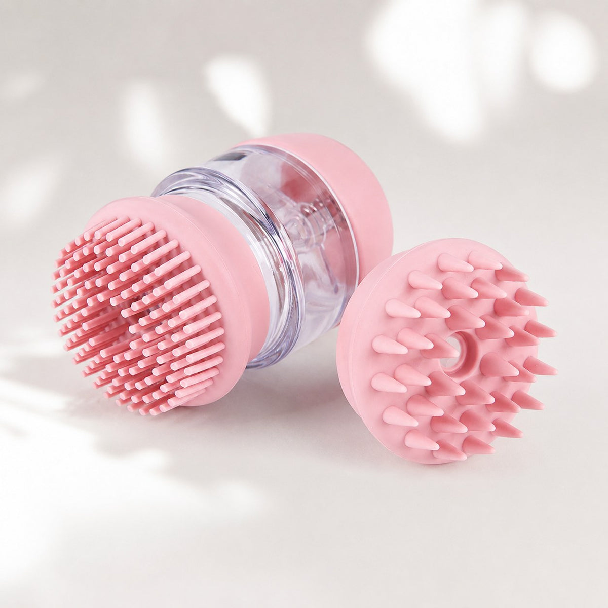 Pink silicone pet massage brush with interchangeable grooming heads