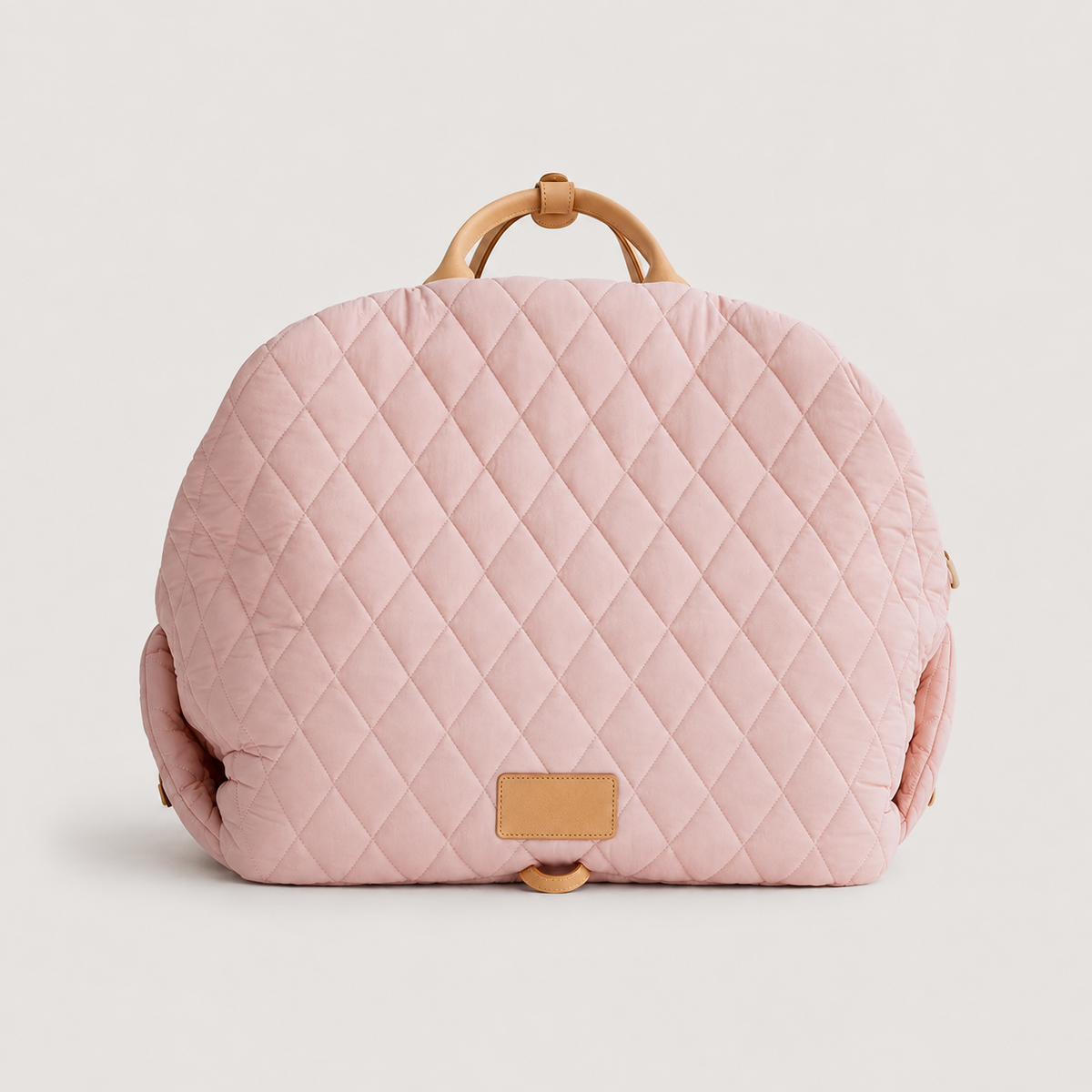 Pink quilted comfort pet carrier bag front view with tan handles