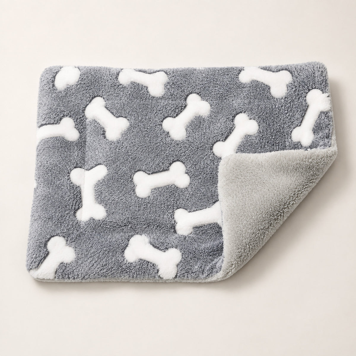 Folded reversible plush dog mat showing soft gray and white surfaces