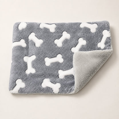 Folded reversible plush dog mat showing soft gray and white surfaces