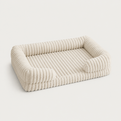 SoftHaven ribbed bolster dog bed with plush raised sides in a neutral color