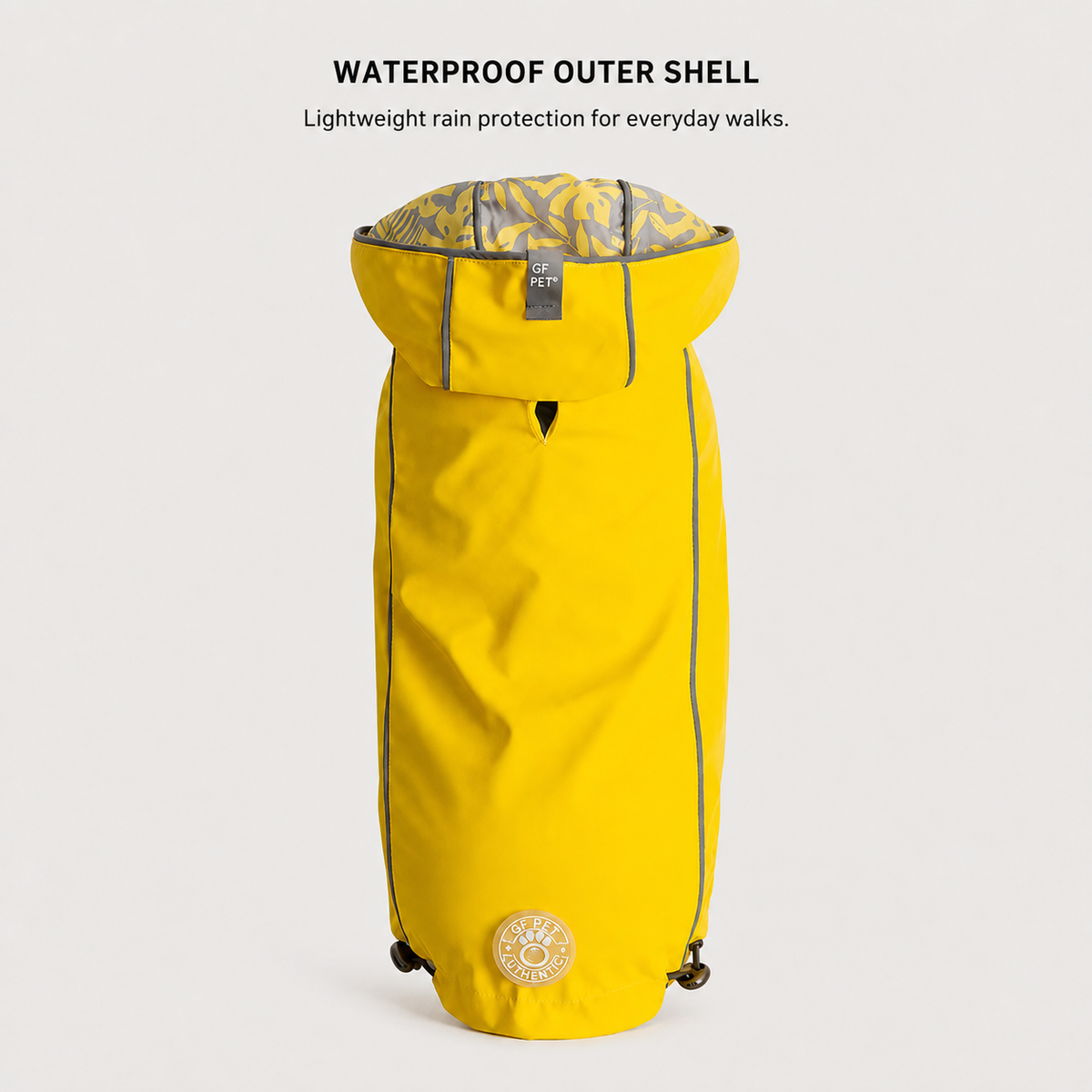 Yellow waterproof dog raincoat with adjustable rain hood.